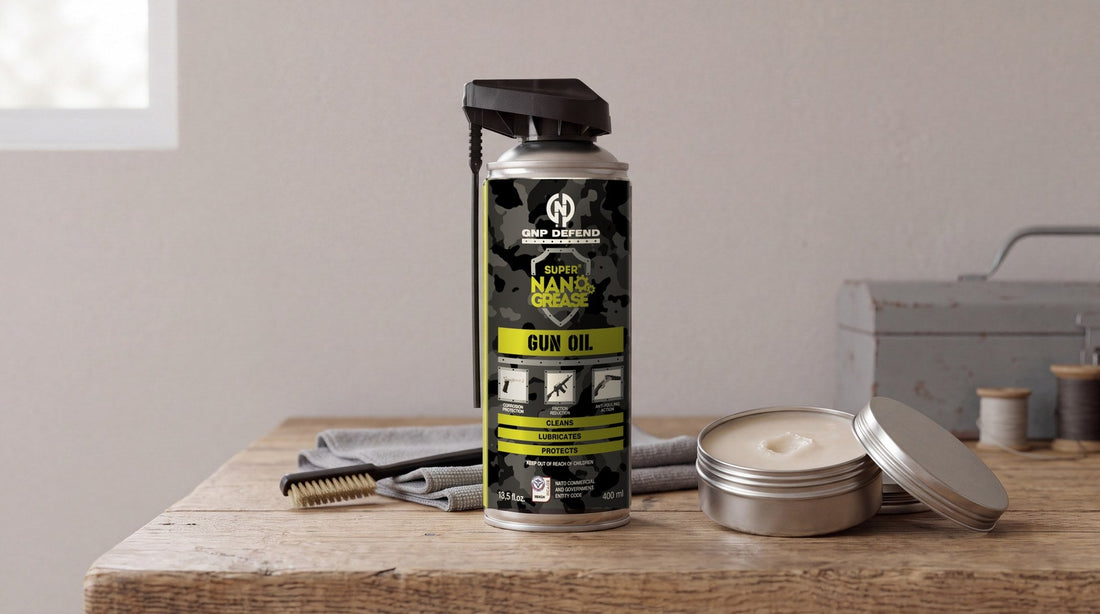 GNP Defend Gun Oil aerosol next to an open tin of gun lubricant paste on a workbench