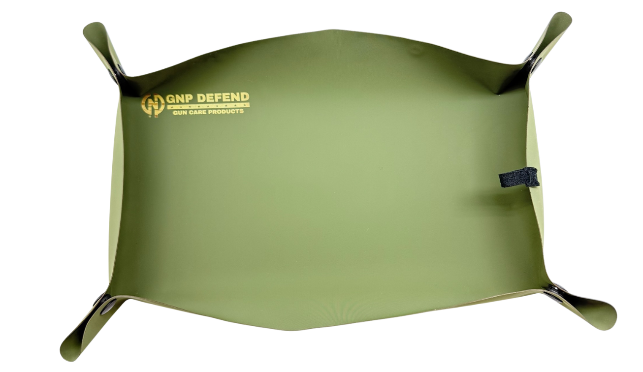 OD Green Cordura ballistic range mat with corners snapped up into a parts tray — GNP Defend