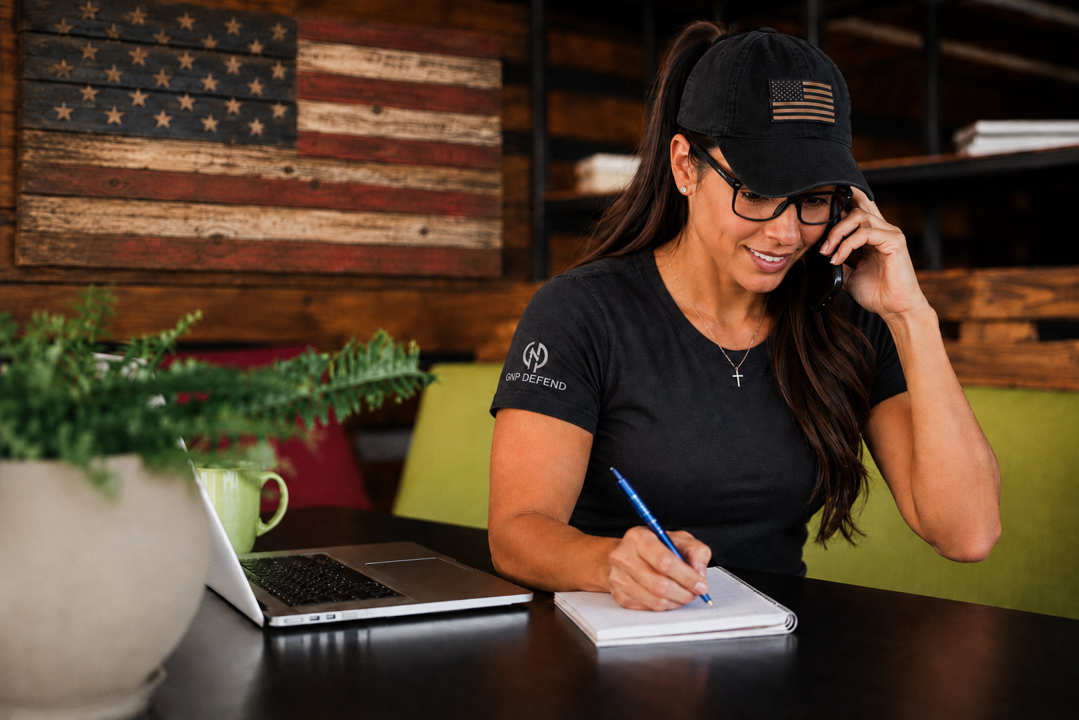 GNP Defend customer support taking a call and notes
