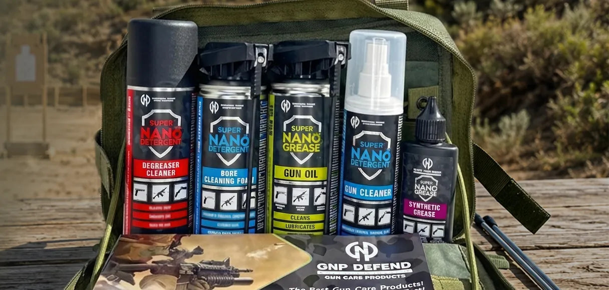 GNP Defend Range Bag open on a wooden range bench with Degreaser, Bore Cleaning Foam, Gun Oil, Gun Cleaner and Synthetic Grease, and a GNP Defend gun care flyer in front